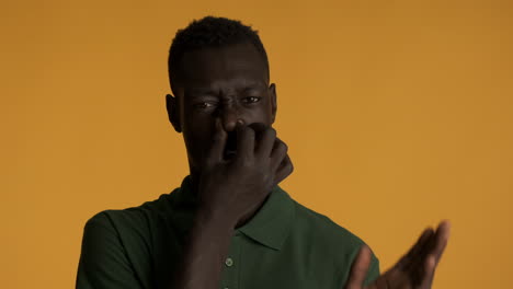 African-american-man-on-yellow-background.