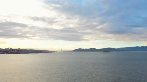 aerial: san francisco golden gate bridge and alcatraz island, drone view