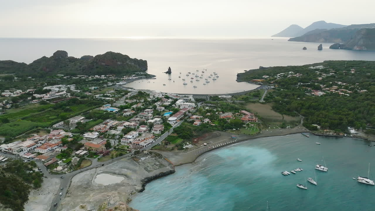 Aerial view of coastal island village with boats