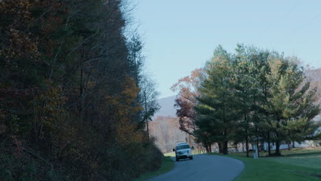 country road in autumn and truck