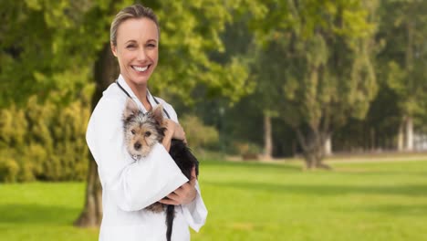 Animation-of-happy-caucasian-female-vet-holding-yorkshire-terrier-pet-dog,-over-trees-in-park