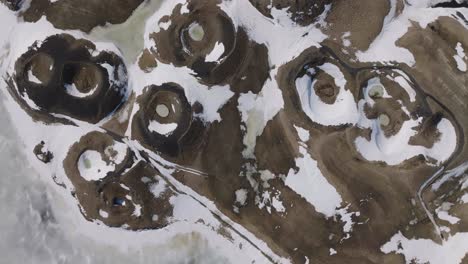Top-Down-Aerial-View,-Snow-Capped-Volcanic-Craters-in-Landscape-of-North-Iceland