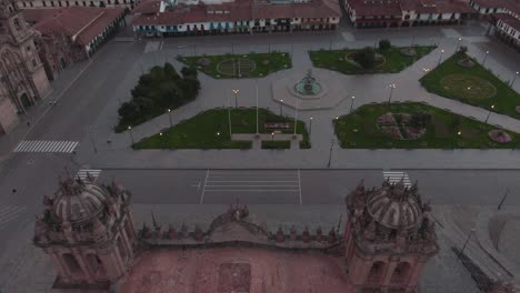 4k-daytime-aerial-drone-footage-over-the-main-Cathedral-from-Plaza-de-Armas-in-Cusco,-Peru-during-Coronavirus-lockdown