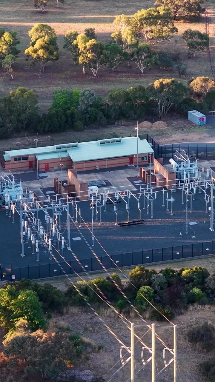 Vertical Aerial View of an Electrical Substation with Power Lines