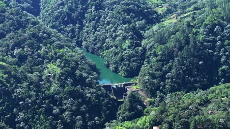 tireo dam between bonao lush mountains in dominican republic