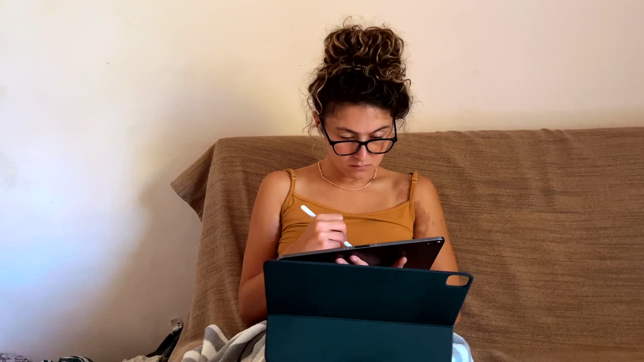 Native American woman working from home on tablet