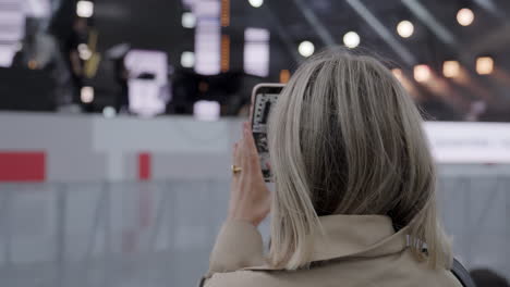 woman taking photo at an event