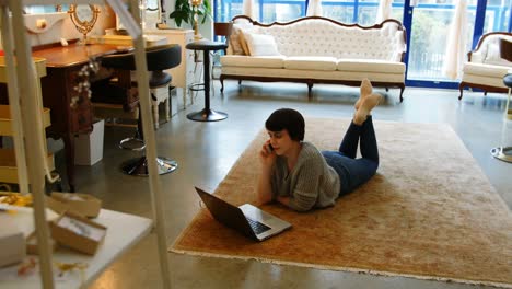 woman talking on mobile phone in living room