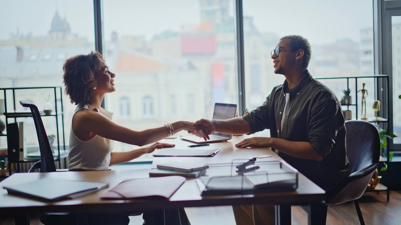 Business partners signing contract office meeting. Handshake deal agreement.