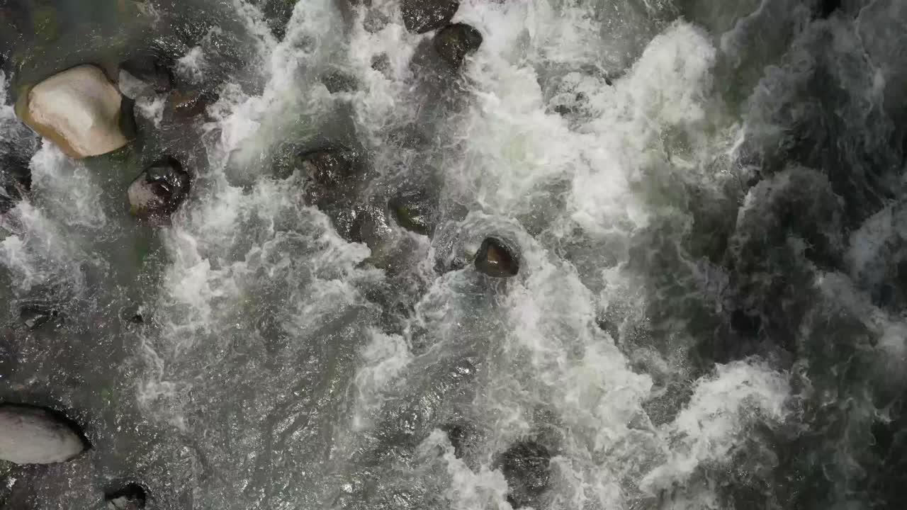 White water rapids flowing quickly down a rocky riverbed