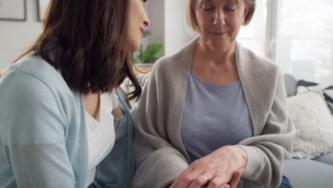 Tilt-up-video-of-adult-daughter-comforting-senior-mother