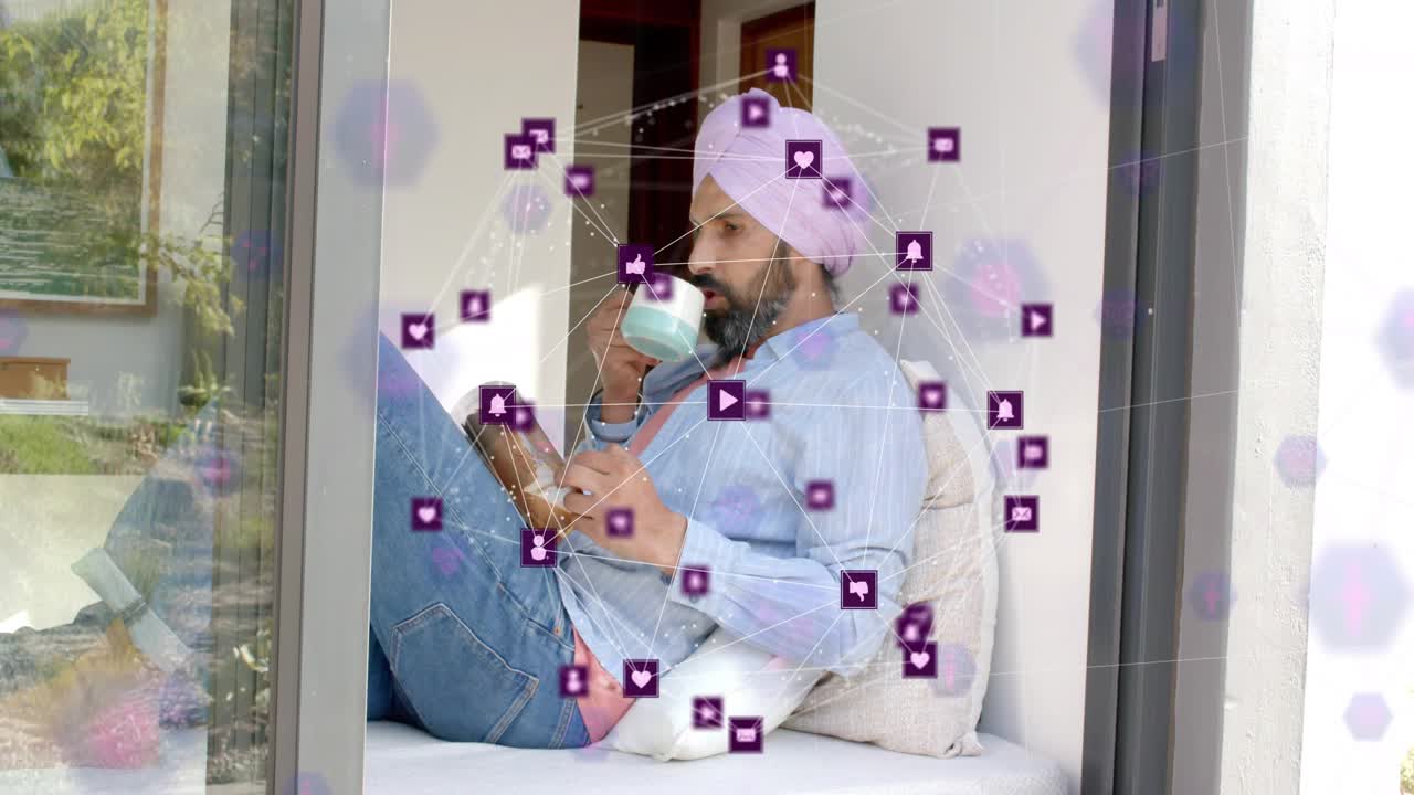 Mid adult man reading, sipping mug and glancing up, hex overlay appearing, social icons clustering