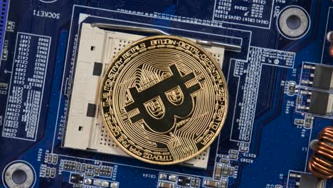 Bitcoin Coin on Computer Motherboard