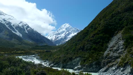 expansive view captures clouds drifting towards mount cook, creating a mesmerizing spectacle in the vast sky