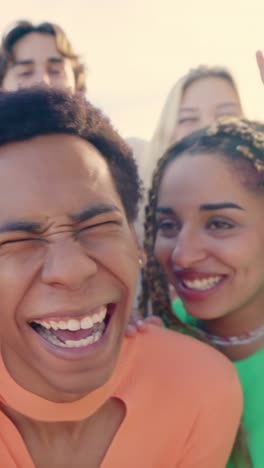 smiling crazy multi-ethnic people taking selfies during sunset