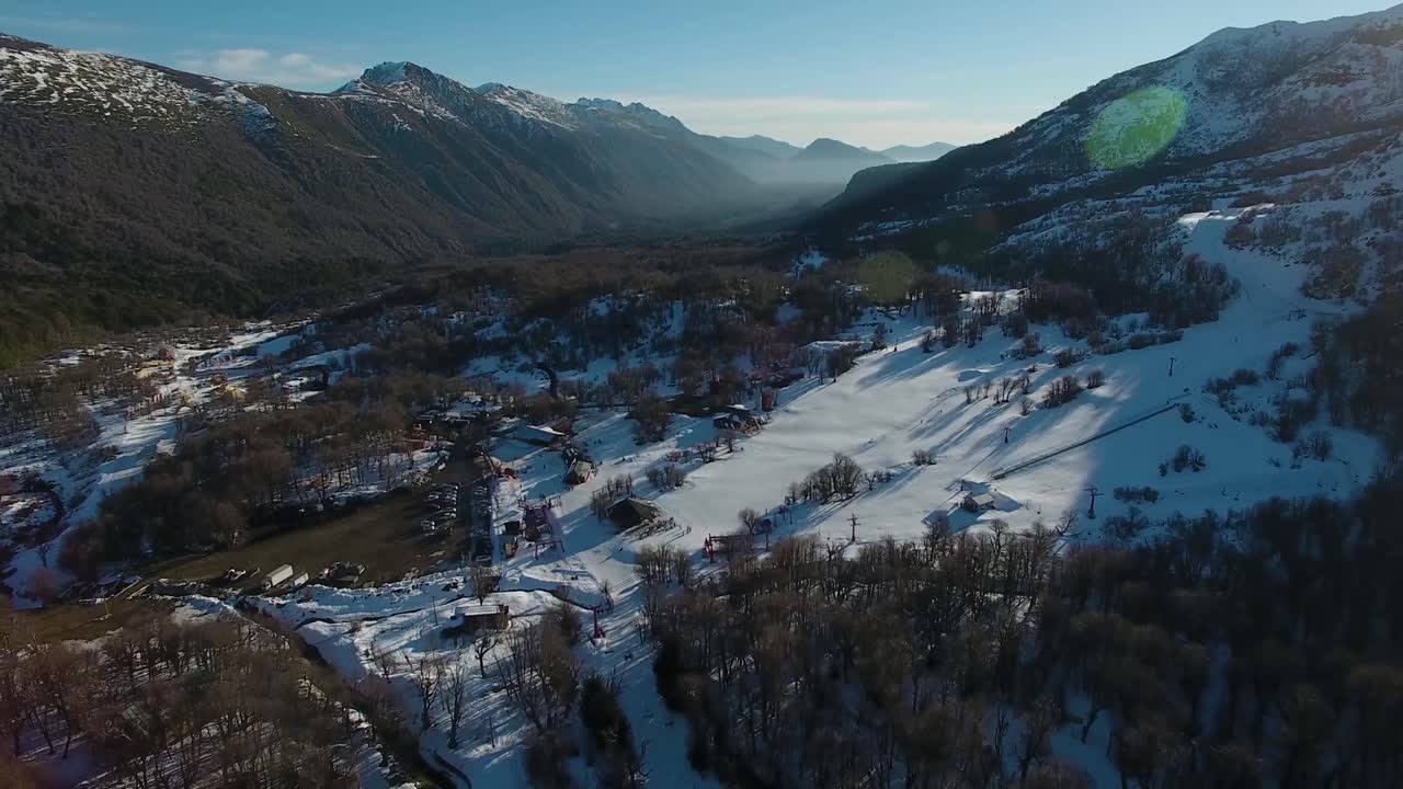 Ski town mountain range sunset during winter season in Chillan, south Chile.