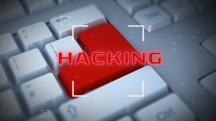 Animation of hacking text with white marker over computer keyboard with red key