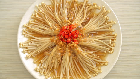 homemade steamed golden needle mushroom or enokitake with soy sauce, chilli and garlic