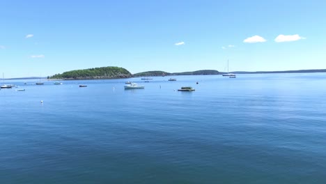tranquil ocean scene with boats and island
