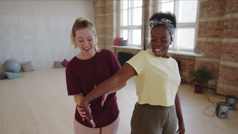 young afro woman having private dance lesson with female teacher