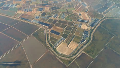 the hon khoi salt fields aerial view, located in nha trang where mounds of natural salt are manually harvested from shallow fields along doc let beach, vietnam