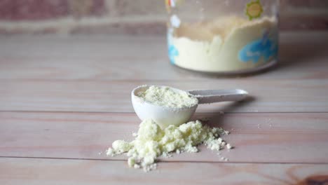 baby milk powder in measuring spoon