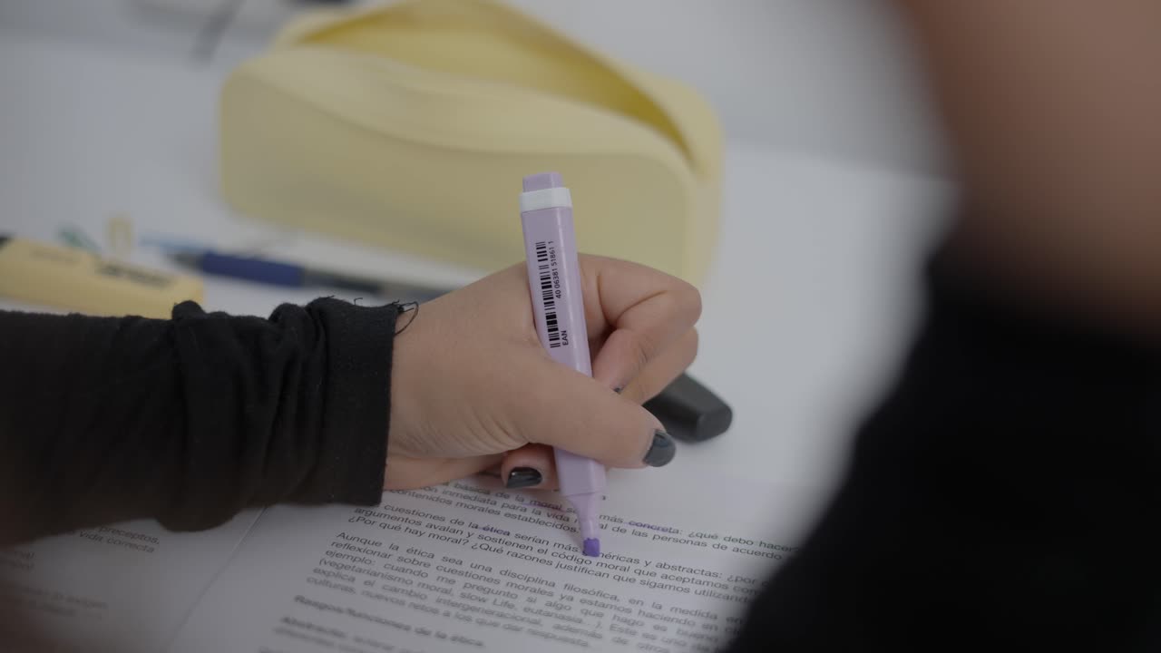 Person Taking Notes During a Meeting or Workshop
