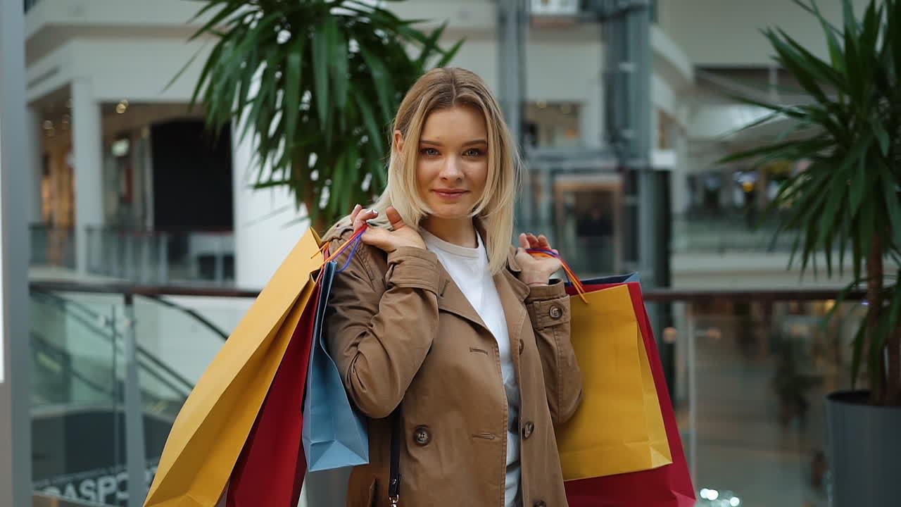Woman holding shopping bags at the mall