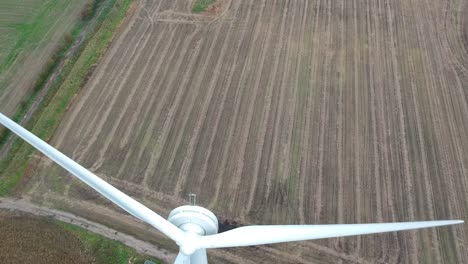 Slow-panning-down-shot-over-wind-turbine