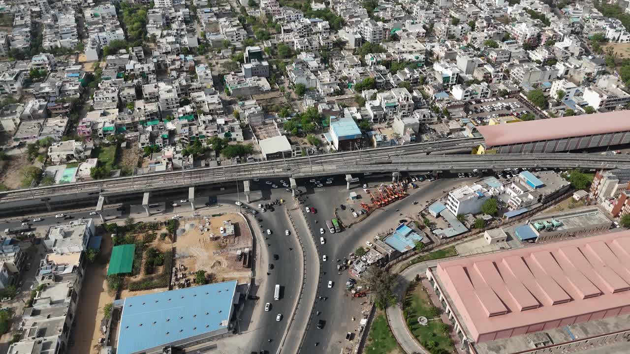 Scenic perspective of Jaipur's bustling neighborhoods with metro station in the middle
