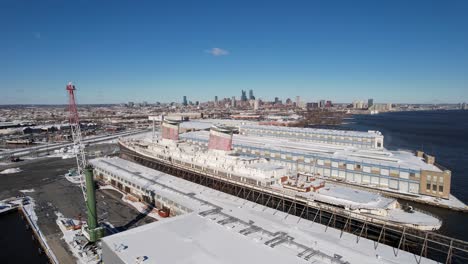 descending drone shot ss united states philly skyline in back