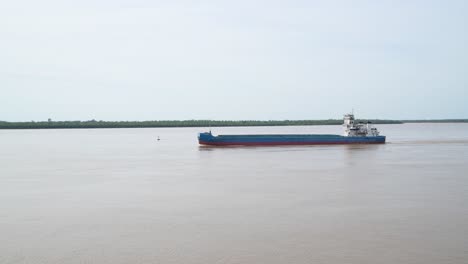 an empty sea vessel sailing on paraná river in argentina