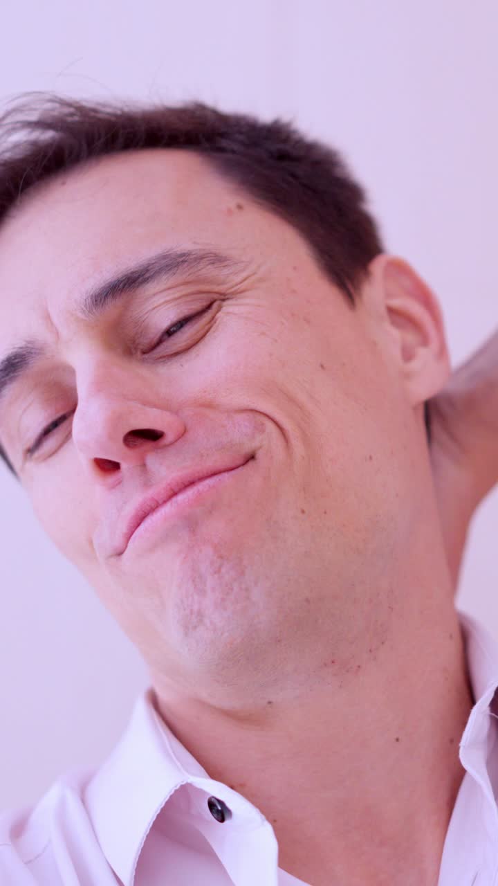 Narcissistic man taking selfies with smartphone in bathroom mirror