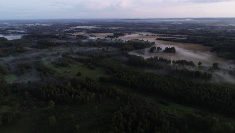 Flight-above-sunset-fog-in-golden-hour-after-rain