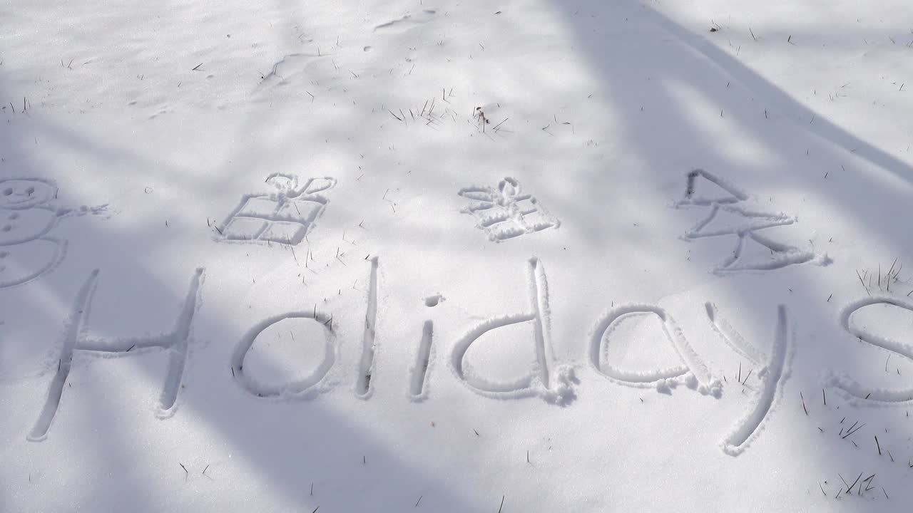 Inscription of holidays on snow. Shooting in the winter