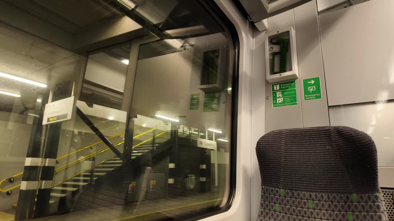 Coventry train station stop view from train carriage window United Kingdom transport