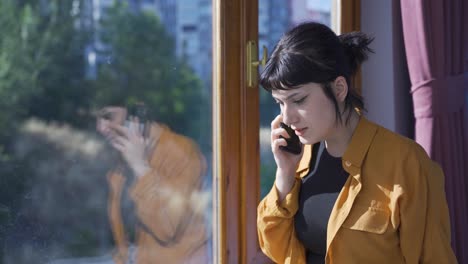 the young woman is talking on the phone, arguing.