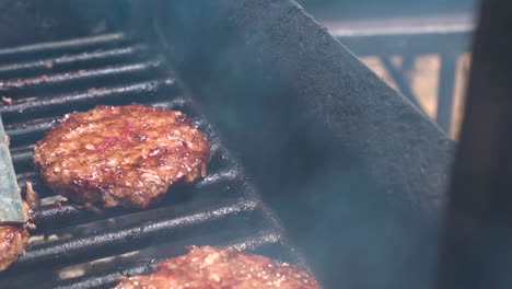 taking generic burgers off the grill