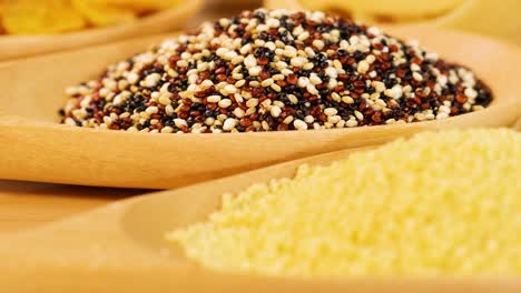 Close-up shots of various grains, pasta, and bread under warm lighting, highlighting textures and colors
