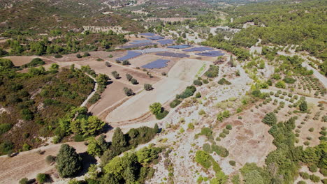 aerial view of solar panels in a rural landscape on a sunny day