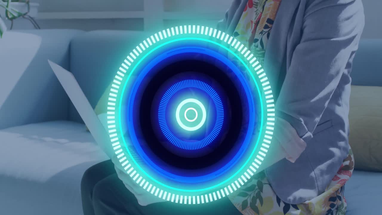 Animation of scope scanning over caucasian businesswoman using laptop