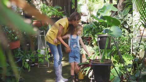 mother and daughter passing time together in a botanical garden