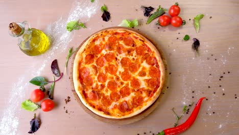 salami pizza on wooden board on the table.