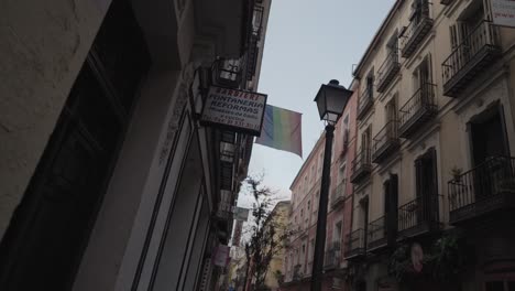 City street with LGBTQ pride flag