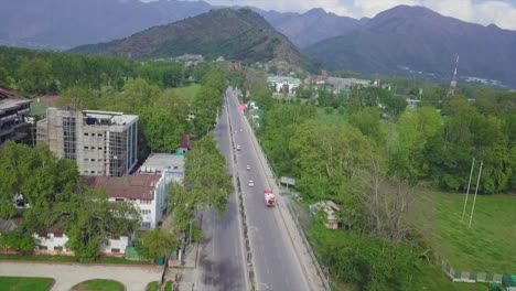 Green-city-srinagar-dalgate-Drone-shoot-of-roads-buildings-vehicles-in-Srinagar-city-of-Jammu-and-Kashmir-during-coronavirus-lockdown,-clean-city-green-city-nice-landscape