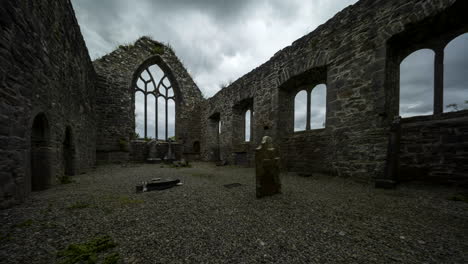 Panorama-motion-time-lapse-of-Creevelea-Abbey-medieval-ruin-in-county-Leitrim-in-Ireland-as-a-historical-sightseeing-landmark-and-graveyard-with-dramatic-clouds-in-the-sky
