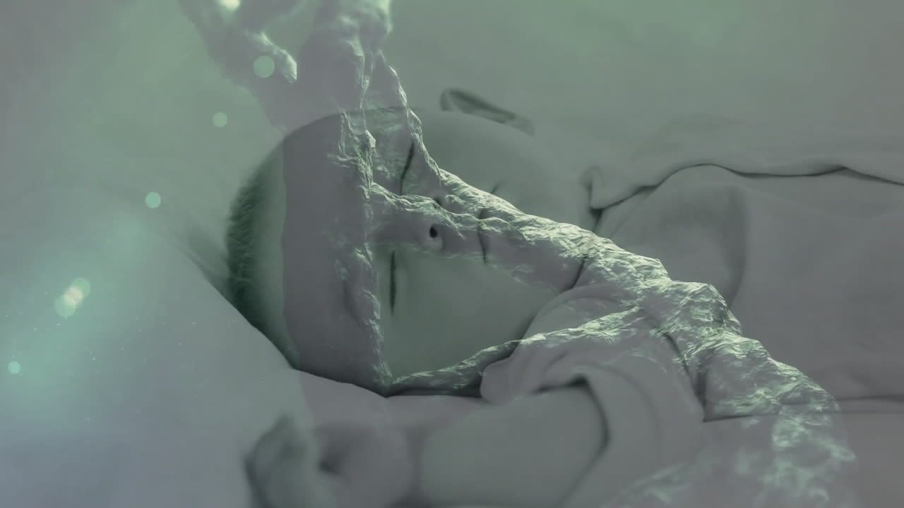 animación de una cadena de adn giratoria sobre un bebé caucásico durmiendo
