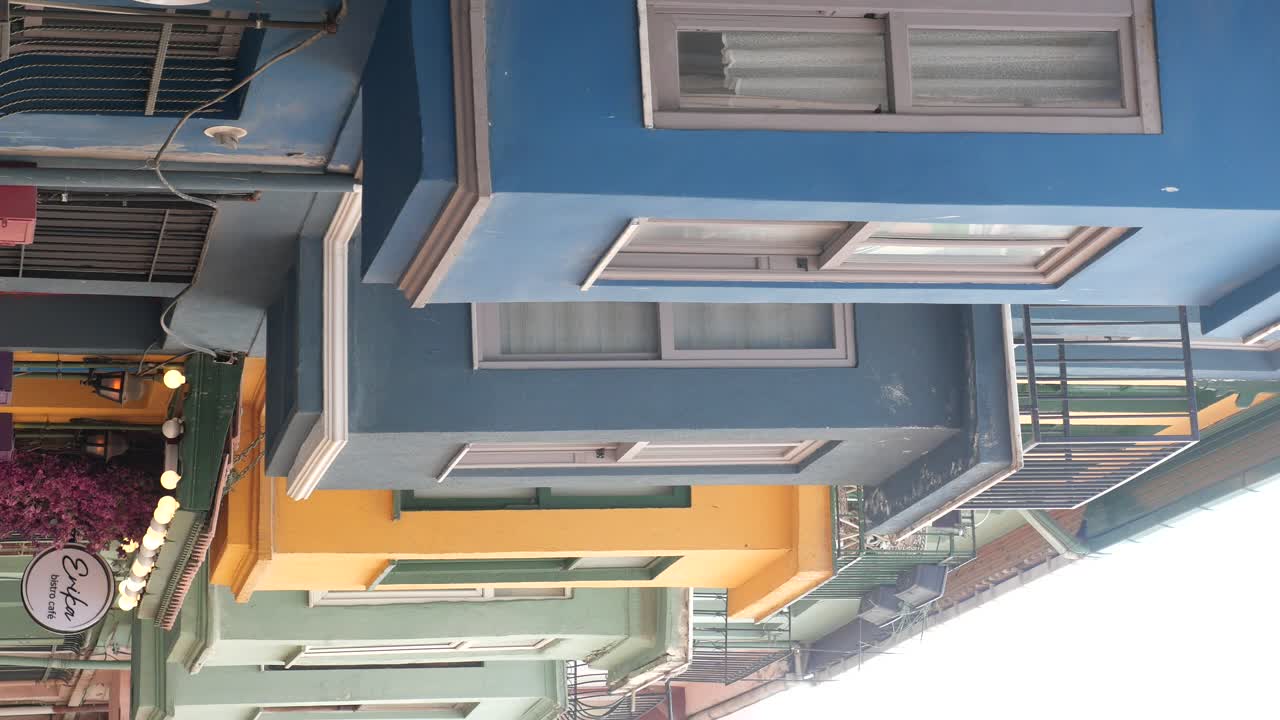 Colorful Architectural Facades and a Bistro on an Urban Street