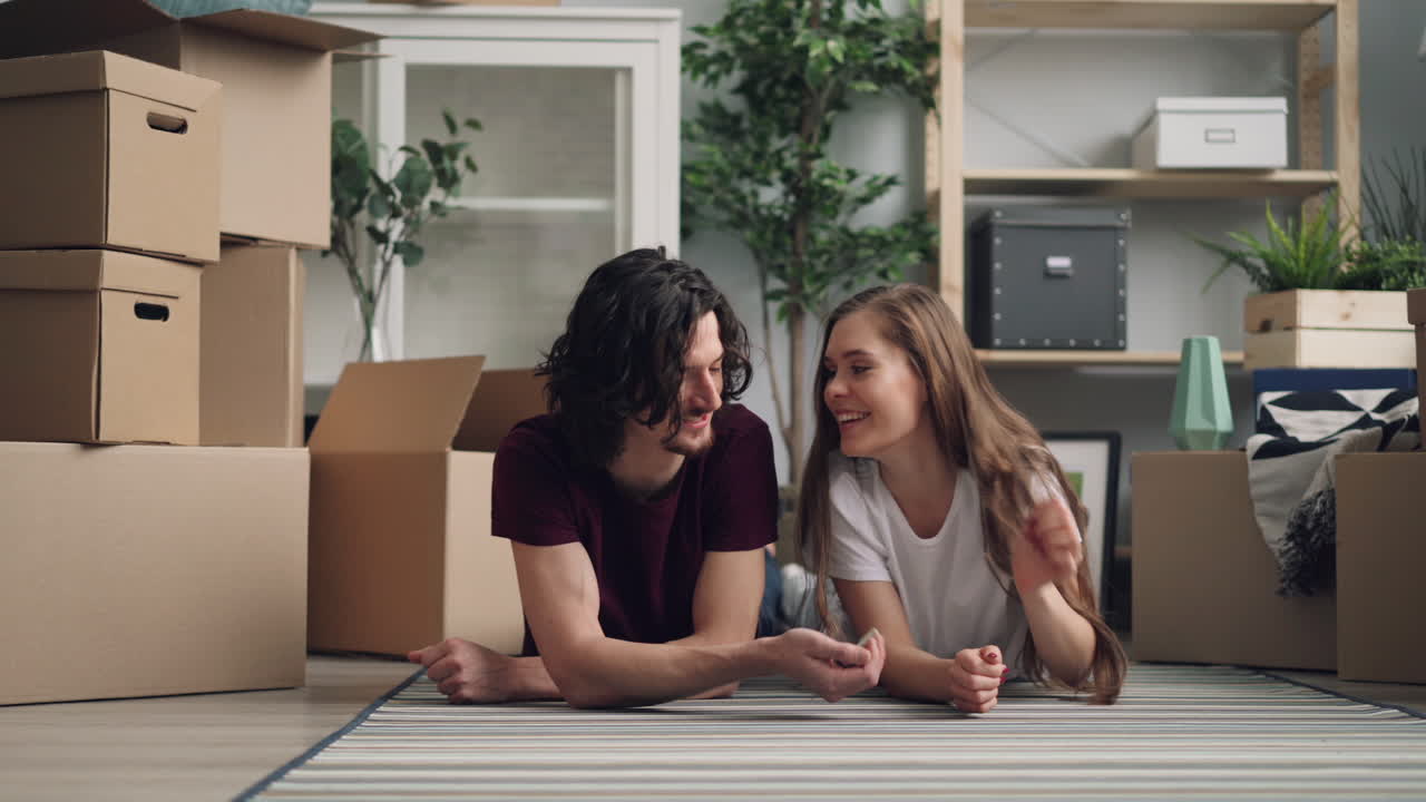 Couple moving into their new apartment