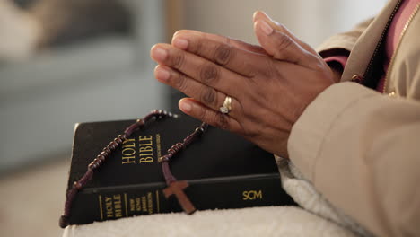 rosary, bible or hands of person praying